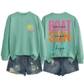 Flat lay of mint green sweatshirt with 'LAKE DAYS' print and distressed denim shorts - Light Green-Black Text Print