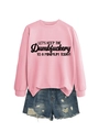 Pink crewneck sweatshirt featuring black slogan and distressed denim shorts for a casual look - S / Pink (Black Print)