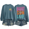 Detailed front and back view of blue Lake Days sweatshirt and distressed denim shorts - Blue-White Text Print