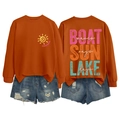 Detail of boat sun lake waves graphic sweatshirt with distressed denim shorts set - Burnt Orange-White Text Print