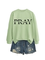 Detailed flat lay of mint green sweatshirt with PRAY slogan and distressed denim shorts - Olive Green (Black Font)