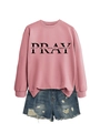 Detail of pink crewneck sweatshirt with Pray text print and denim shorts on white background - Rose Gold (Black Font)