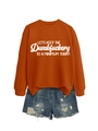 Flat lay of an orange long-sleeve slogan sweatshirt with blue distressed denim shorts - S / Burnt Orange (White Font)