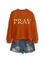 Detail of caramel sweatshirt with white Pray text and distressed denim shorts - Burnt Orange (White Font)