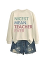 Detail of Nicest Mean Teacher Ever beige sweatshirt paired with ripped denim shorts - Sand