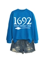 Detail of royal blue crewneck sweatshirt with 1692 they missed one text and broom print - Lake Blue Sweatshirt (White Font)