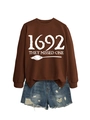 Detail of a brown sweatshirt with 1692 They Missed One print and blue denim shorts - Coffee Sweatshirt (White Font)