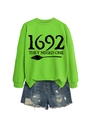 Flat lay of neon green 1692 sweatshirt and distressed denim shorts outfit set - Fluorescent Green Sweatshirt (Black Font)