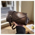 Detail of vintage oil wax leather texture and gold buckle on dark brown crossbody bag - Coffee