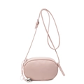 Minimalist light pink oval crossbody bag with lychee texture and heart charm detail - Pink