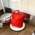Red lychee texture leather bucket bag with drawstring and silver bean metal pendant - Red with Pendant