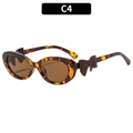 Y2K cat-eye zonnebril met luipaardprint en bruine strikaccenten op het montuur - Schildpad Frame Thee Lenzen (C4)