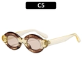 Oval tortoiseshell sunglasses with translucent yellow temples in color C5 - C5 Translucent Yellow Champagne Lens