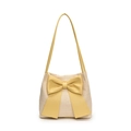 Beige straw tote bag with yellow leather bow accent for summer beach vacations - Yellow
