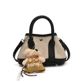 Off-white canvas bucket bag with black leather trim and cute brown plush bear charm - Black Small With Plush Puppy