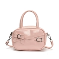 Pink bowling handbag with bow accent and crossbody strap in premium synthetic leather - Pink