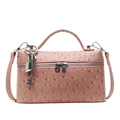 Elegant pink ostrich-pattern handbag with top handle and metal lock detail - With Pendant / Pink