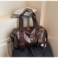 Detail of dark brown vintage faux leather tote bag with bronze rivets and eyelets - One Size / Coffee
