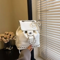 Mini white faux leather backpack with silver chain and pearl bow charm detail - With Pendant / Off White