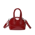 Glossy red patent leather shell bag with adjustable shoulder strap and silver hardware - Red