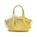 Chic yellow underarm bag with litchi texture, lace bow, and pearl charm detail - Yellow
