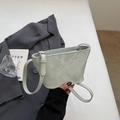 Minimalistische grüne Beuteltasche mit Prägemuster, schicker Umhängetag für Damen. - Blau