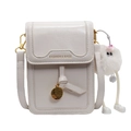 Vertical white faux leather crossbody phone bag with wavy flap and plush pendant charm - With Pendant / White