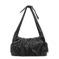 Minimalist black pleated cloud tote bag featuring a decorative shoulder strap knot detail - Gray