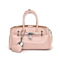 Pink fashion handbag with heart chain pendant and pearl charms in a front-facing studio shot - With Heart Pendant / Pink