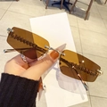 Fashionable rimless polygon sunglasses with brown lenses and silver metal wave detail - Transparent Tea