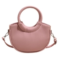 Pink crescent handbag with vertical pleated texture and round handle on white background - Pink