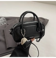 Chic black mini Boston bag in glossy faux leather featuring a heart charm and Logo strap - Black (With Charm)