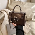 Dark brown patent leather Kelly style handbag with woven charm and metal lock closure - With Pendant / Coffee