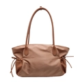 Brown patchwork travel bag featuring fabric body and leather drawstring side details - Tan