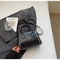 Black leather pillow bag with white contrast stitching and a round top handle - Black (Without Charm)