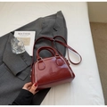Deep red leather boston bag with white wavy stitching and adjustable shoulder strap - Red (No Pendant)