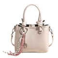 Beige oil wax bucket bag with heart charm and decorative knot strap handle - White With Badminton Charm