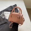 Elegant pink glossy leather bowling bag with rounded handles and a silver-tone strap - No Pendant / Pink