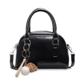 Glossy black bowling bag with top handles, crossbody strap, and sporty charm detail - With Baseball Pendant / Black