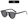Occhiali da sole rotondi neri classici con rivetti argentati e lenti scure - Montatura Nera Lenti Grigie (C1)