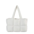 Front view of a white quilted puffer tote bag with spacious design and padded handles - White