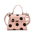 Pink crossbody bag with black polka dots featuring top handle and silver twist lock - Pink