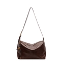 Chic dark brown hobo shoulder bag with crossbody strap and unique striped rope knot charm - Brown