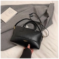 Minimalist black Boston bag in textured synthetic leather with golden hardware straps - Black without Pendant