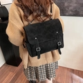 Classic black vintage backpack in matte finish with buckle straps and flap cover - Black