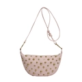 Pink crescent saddle bag with gold rivets and large metal ring on white background - Pink