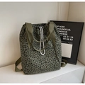 Detail of army green leopard print tote bag with white drawstring closure and woven handles - Army Green