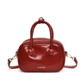 Donkerrode lakleren crossbody tas met rond ontwerp en gouden metalen accenten - Rood