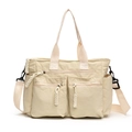 Minimalist cream canvas tote bag featuring multi-pocket design and detachable shoulder strap - White