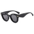 Fashionable black thick frame cat eye sunglasses with gold rivet accents on white background - Glossy Black/Grey Lens